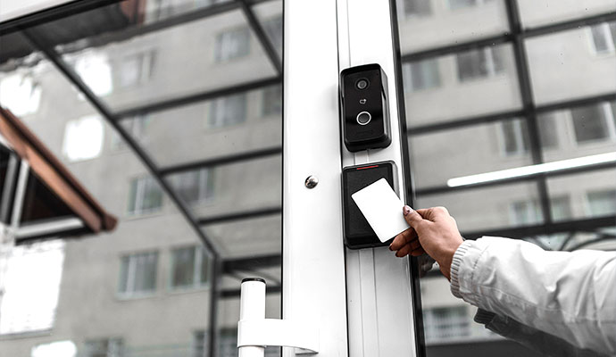 Person using a keycard to enter a building
