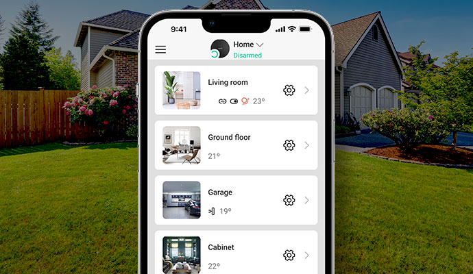 Smartphone showing an emergency alarm signal on a home security system