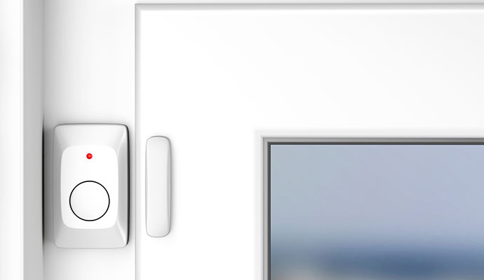 Magnetic window and door contact alarm sensor installed on an entry frame