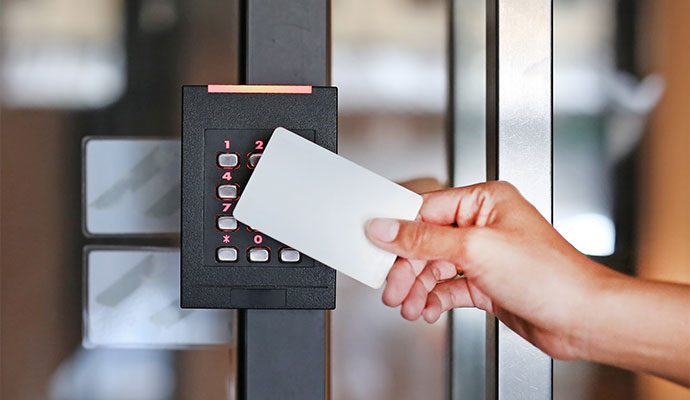 Person using a keycard to access a secure area