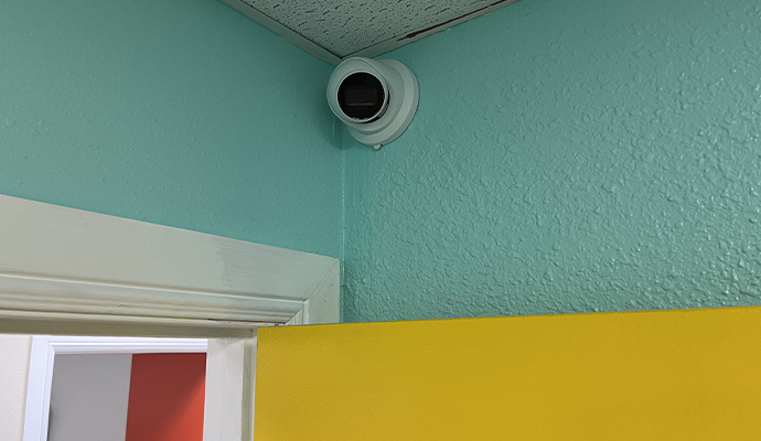 Indoor security camera mounted on a residential ceiling