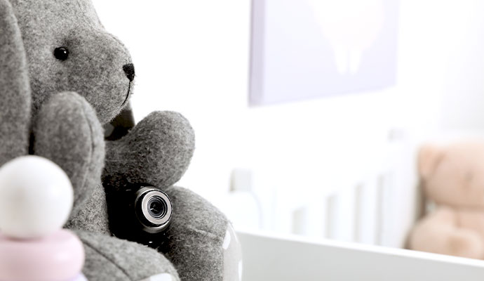Miniature hidden security camera placed inside a plush toy