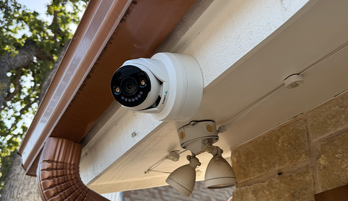 Outdoor security camera installed under a roof overhang