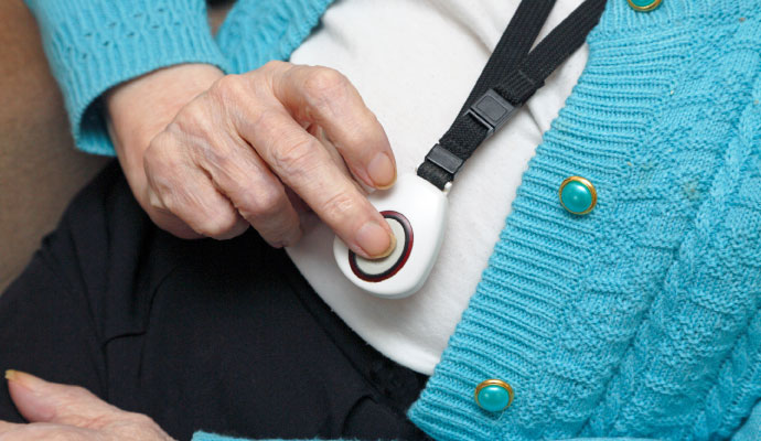 A person interacting with medical alert system