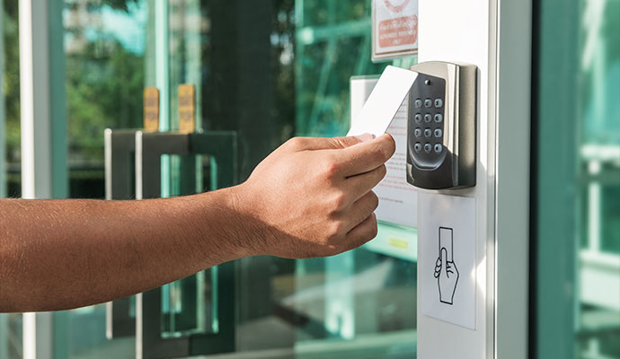 Person using card reader to access