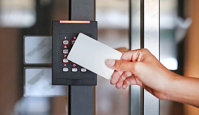 Person using card reader to access