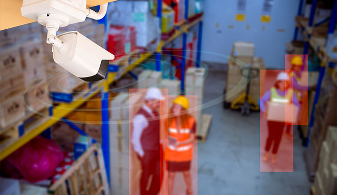 Security camera with motion detection monitoring warehouse inventory and personnel